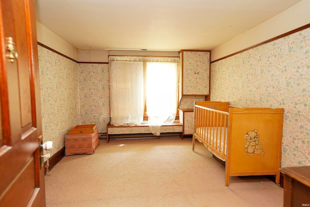 unfurnished bedroom with light carpet and a crib