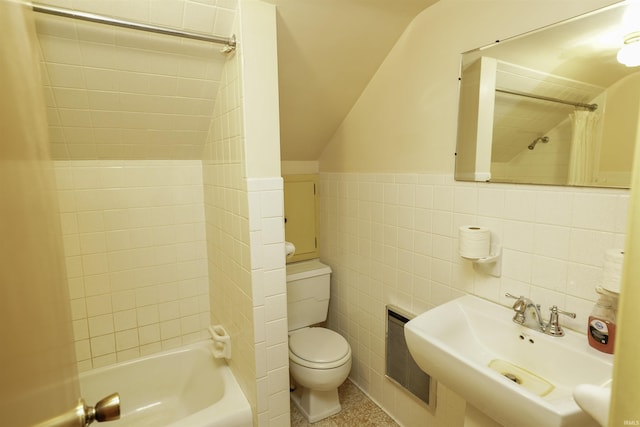 bathroom with toilet, shower / tub combo, a sink, visible vents, and tile walls