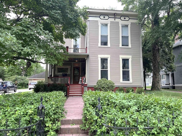 italianate house featuring covered porch