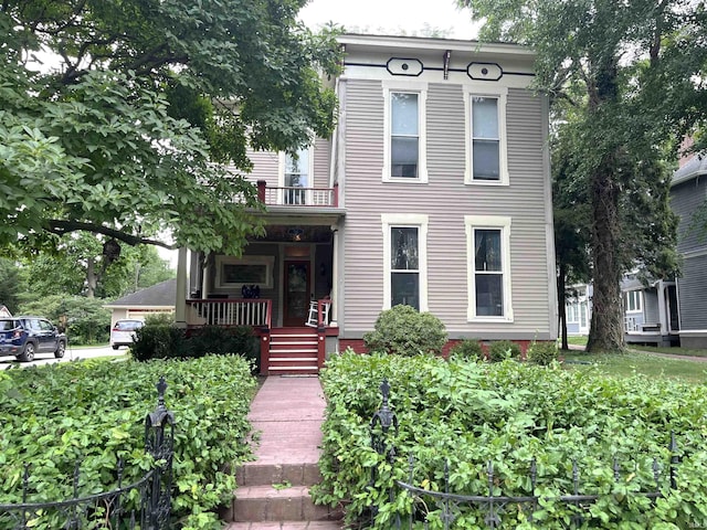 italianate-style house with a balcony