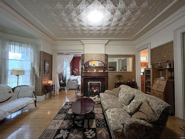 living room featuring crown molding and hardwood / wood-style floors