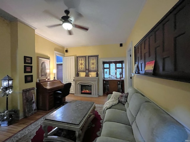 living room featuring hardwood / wood-style flooring and ceiling fan