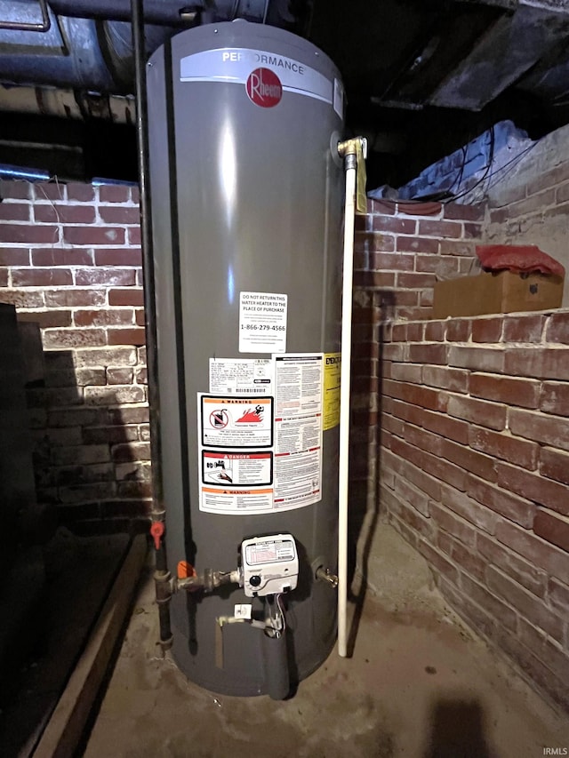 utility room with gas water heater