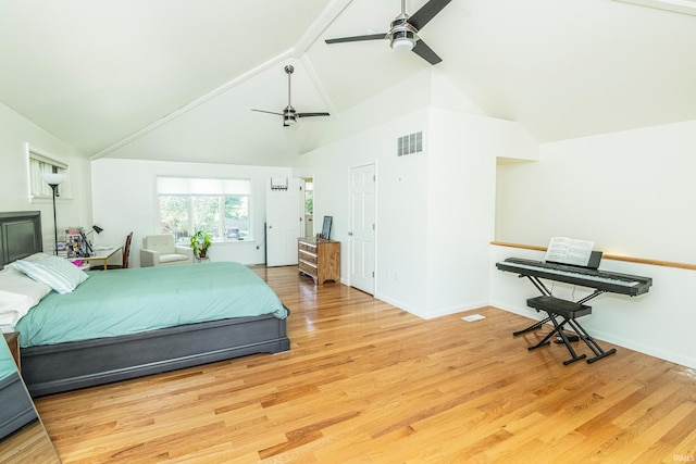 bedroom featuring high vaulted ceiling, beam ceiling, ceiling fan, and light wood-type flooring