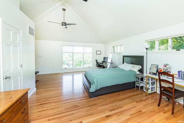 bedroom with high vaulted ceiling, ceiling fan, and light hardwood / wood-style floors