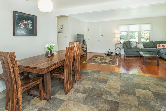 dining area with dark hardwood / wood-style floors