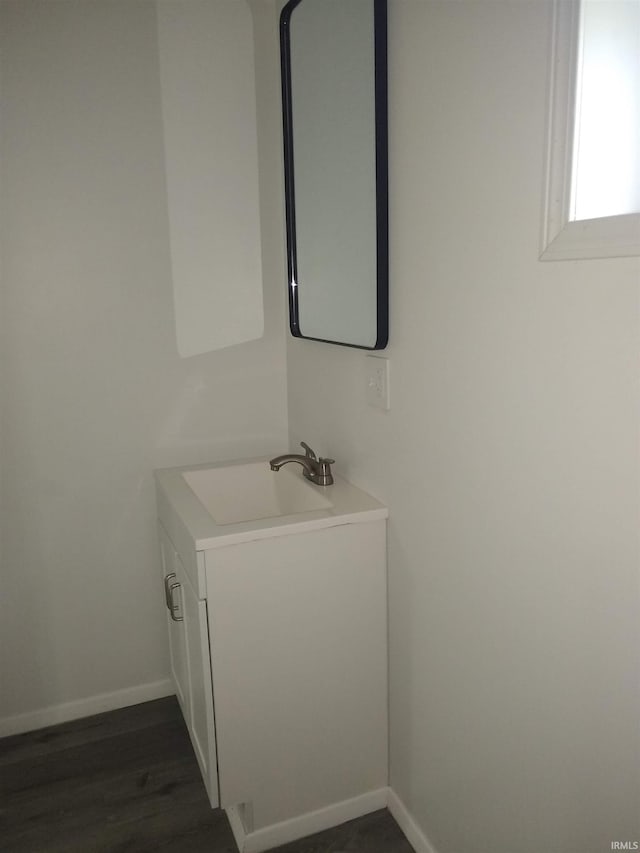 bathroom featuring hardwood / wood-style flooring and vanity