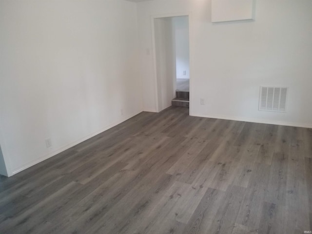 spare room with wood-type flooring