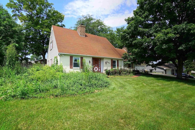5429 Raleigh Dr, South Bend, IN 46614 - cape cod home with a chimney and a front yard