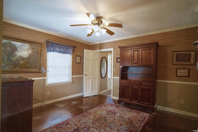 entrance foyer featuring crown molding, ceiling fan, and dark wood-type flooring