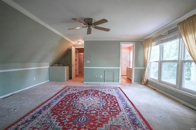 bonus room with vaulted ceiling, ceiling fan, and light colored carpet