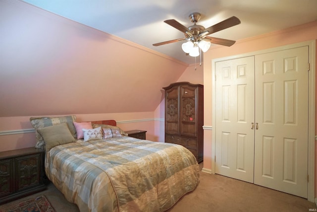 carpeted bedroom with crown molding, vaulted ceiling, and ceiling fan