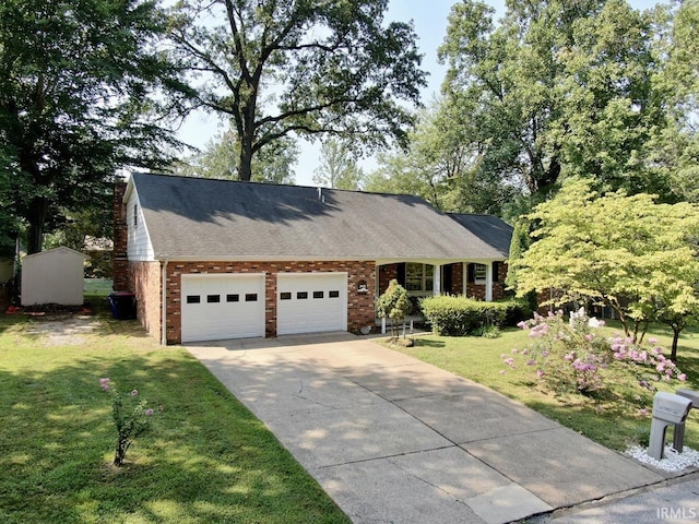 view of front of home featuring a garage and a front yard