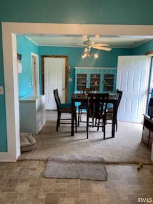 tiled dining room with ceiling fan