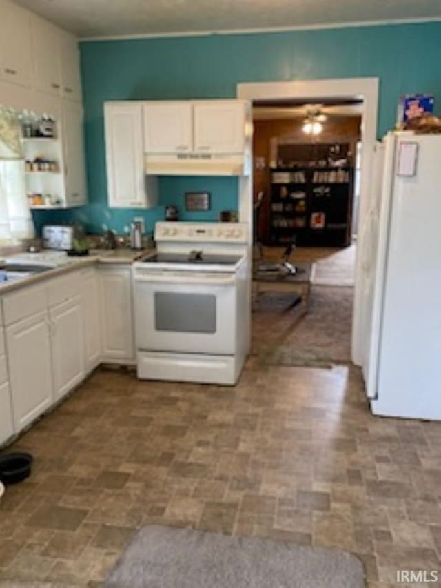 kitchen featuring white cabinets, tile patterned floors, white appliances, and sink