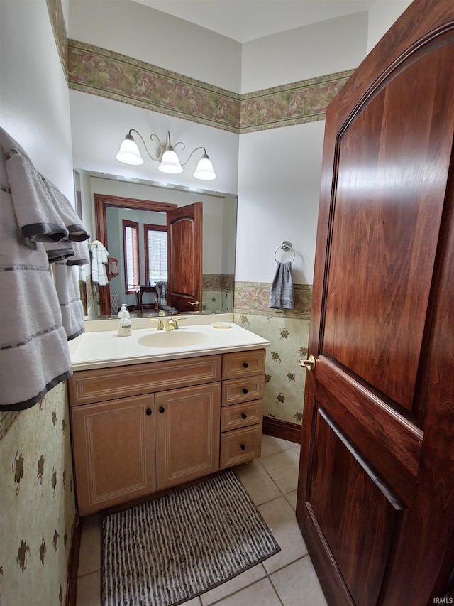 bathroom featuring a wainscoted wall, tile walls, vanity, and tile patterned floors