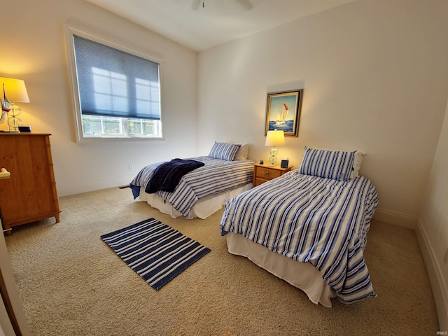 bedroom featuring carpet floors and baseboards