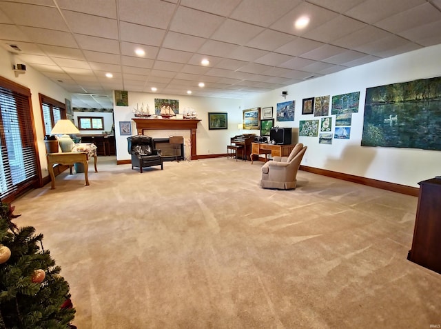 carpeted living room with recessed lighting, a fireplace, a paneled ceiling, and baseboards