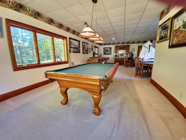 recreation room featuring light carpet, baseboards, a drop ceiling, and pool table