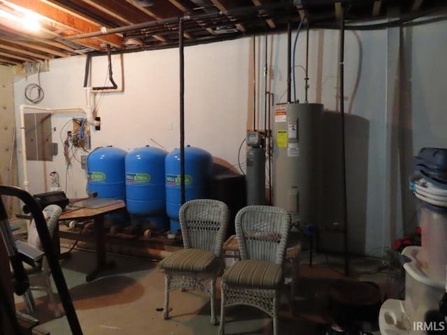 unfinished basement featuring electric water heater