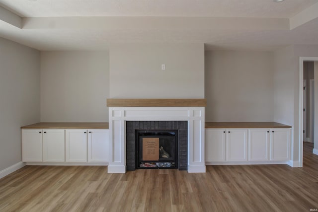 unfurnished living room with light hardwood / wood-style floors