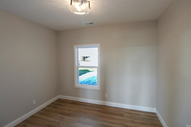 empty room featuring dark hardwood / wood-style floors