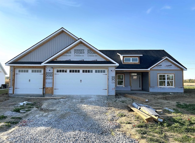 view of front facade featuring covered porch and a garage