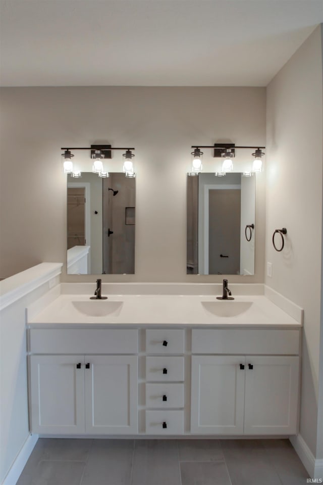 bathroom with tile patterned flooring and vanity