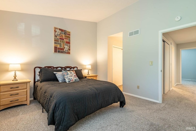 bedroom with light colored carpet