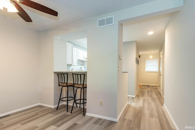 hall with light hardwood / wood-style flooring