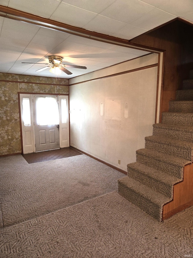 interior space featuring carpet floors and ceiling fan