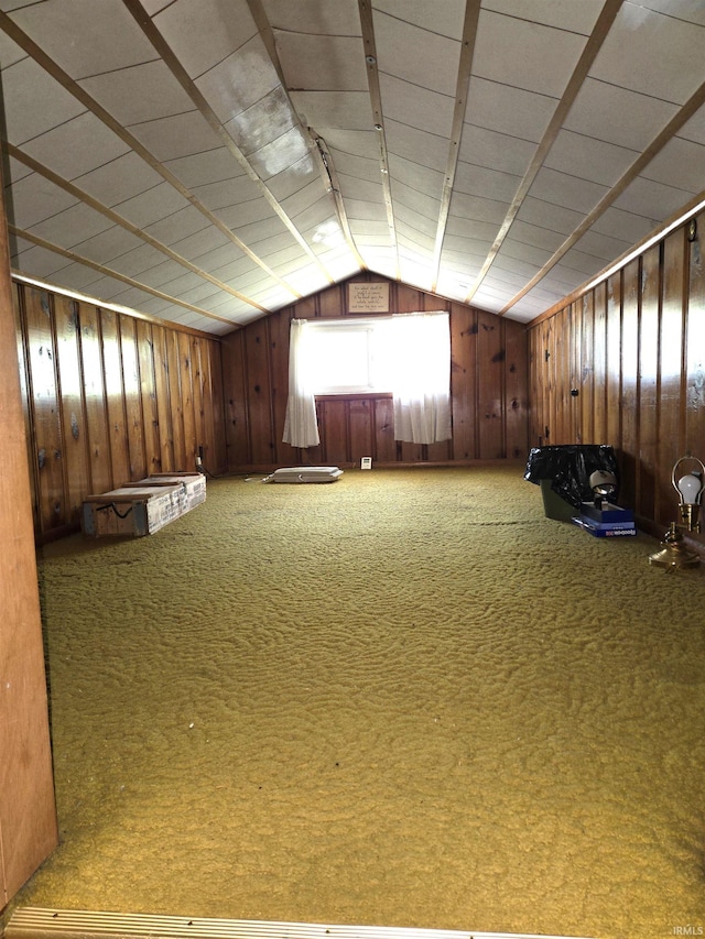 interior space with carpet floors and lofted ceiling