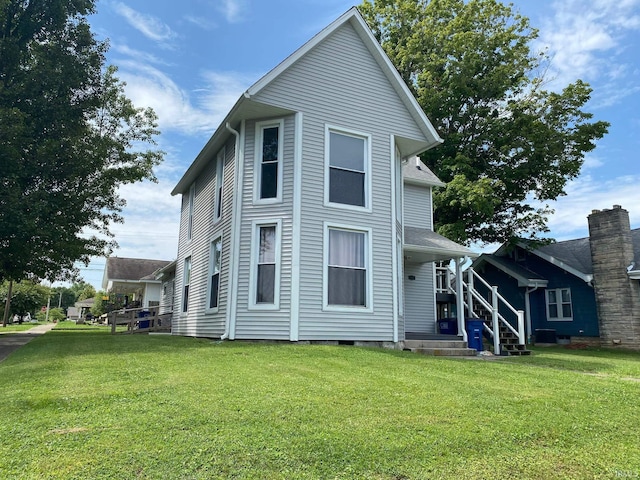 view of property exterior with central AC unit and a yard