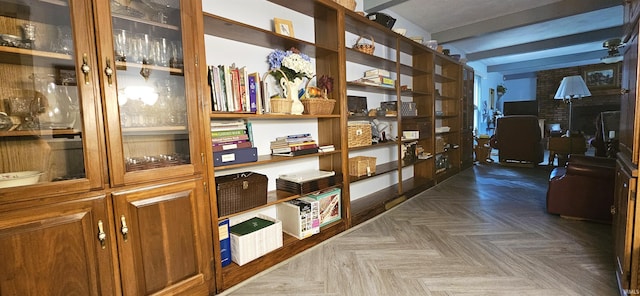 hall with beamed ceiling