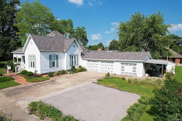 view of front of home with a garage and driveway
