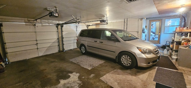 garage featuring a garage door opener
