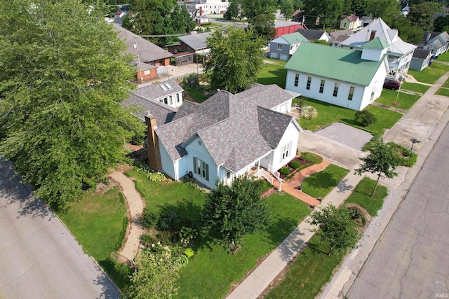 birds eye view of property with a residential view