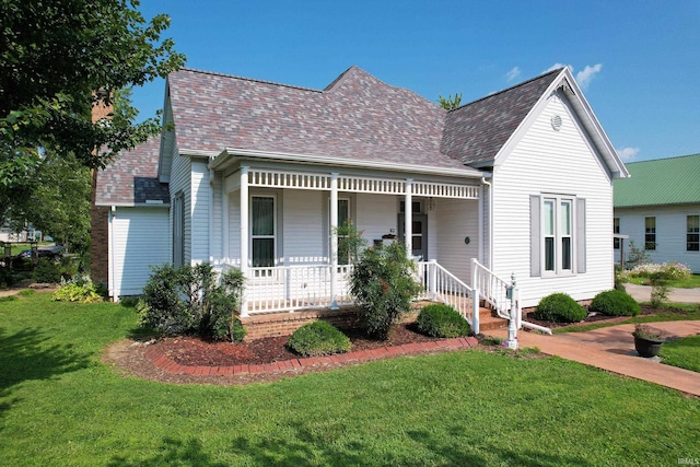 view of front of home with a front lawn and covered porch