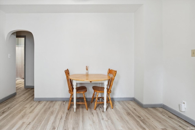 dining space with light wood-type flooring