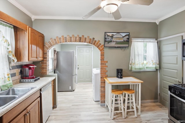 kitchen with ceiling fan, range, white dishwasher, stainless steel fridge, and light hardwood / wood-style flooring