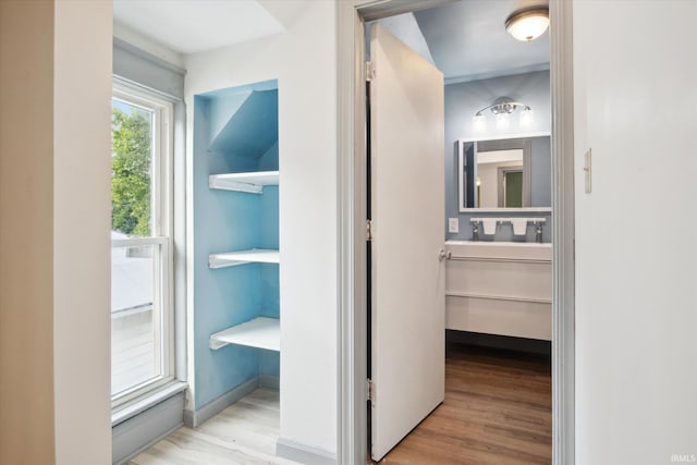 corridor featuring light hardwood / wood-style floors