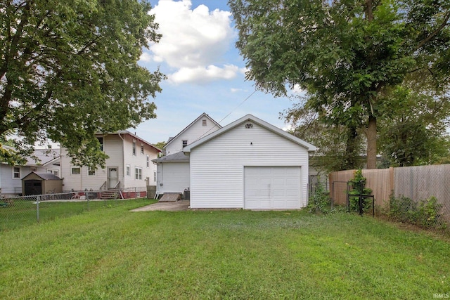 garage featuring a lawn