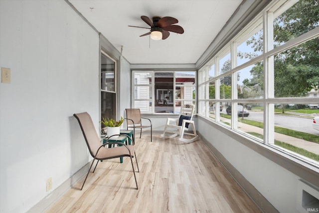 sunroom featuring ceiling fan