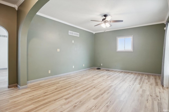 empty room with ceiling fan, light wood-type flooring, and ornamental molding