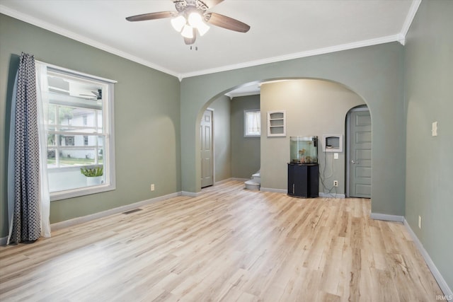 unfurnished living room featuring light hardwood / wood-style floors, ceiling fan, and crown molding