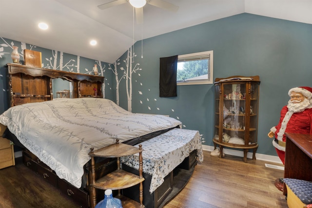 bedroom with vaulted ceiling, hardwood / wood-style floors, and ceiling fan