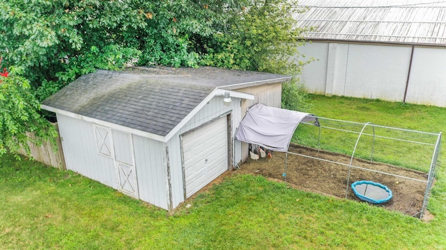 view of outbuilding featuring a yard