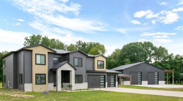 view of front facade with a garage and a front yard