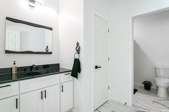 bathroom with vanity, toilet, and tile patterned floors