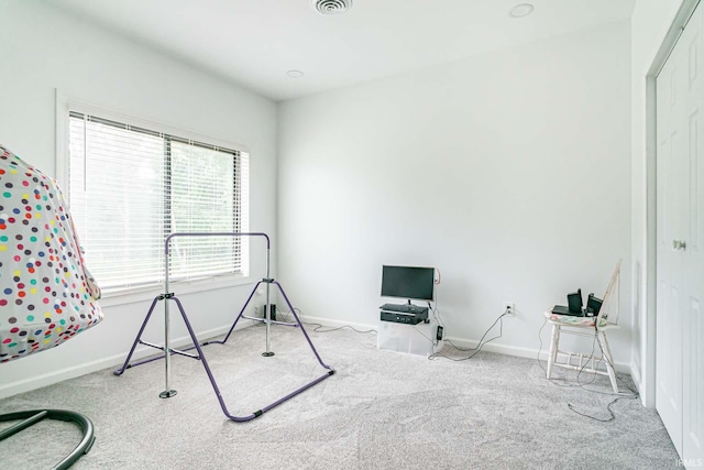 workout area featuring carpet floors